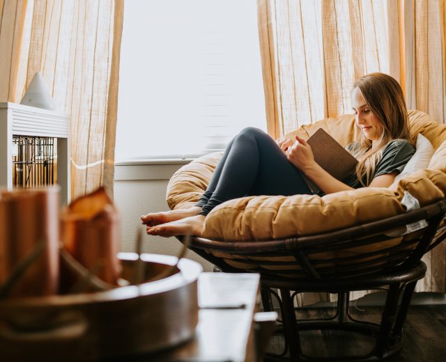 woman reading at home relaxing