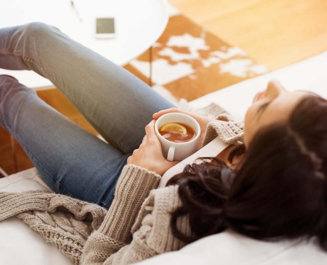 woman relaxing with tea manage mental heath covid